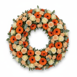 Coroa Calor Eterno – Gérberas Laranja, Cravos Pêssego e Rosas Brancas